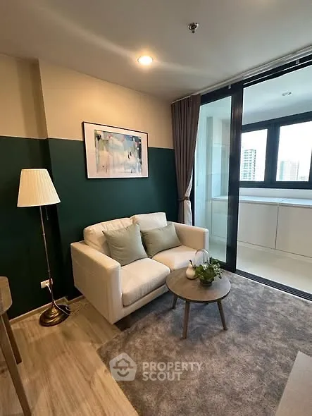 Cozy living room with modern decor and city view balcony