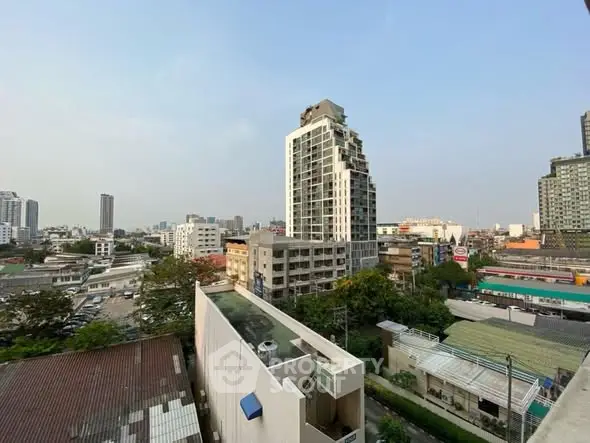 Stunning cityscape view with modern high-rise buildings and clear blue sky.