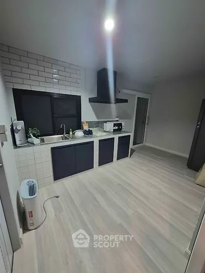 Modern kitchen with sleek cabinetry and open layout