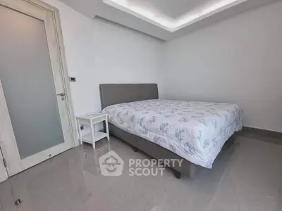 Modern minimalist bedroom with sleek design and polished flooring