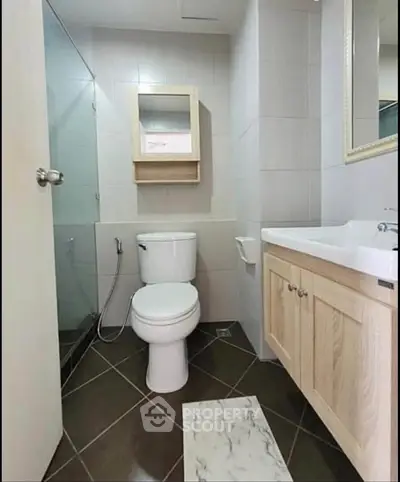 Modern bathroom with sleek fixtures and elegant cabinetry in a contemporary home.