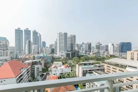 Stunning cityscape view from a high-rise balcony showcasing modern urban living.