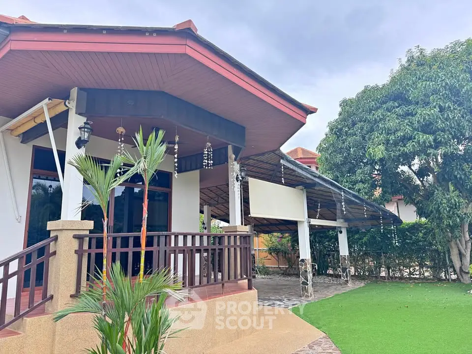 Charming single-story home with spacious patio and lush garden, perfect for outdoor living and relaxation.
