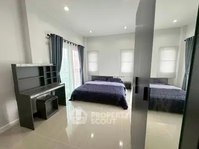 Spacious modern bedroom with elegant decor and natural light