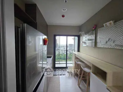 Modern kitchen with open layout and balcony view in stylish apartment