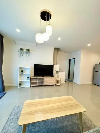 Modern living room with stylish furniture and elegant lighting in a contemporary apartment.