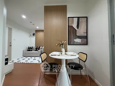 Modern apartment interior with stylish dining area and cozy living room, featuring contemporary decor and warm lighting.