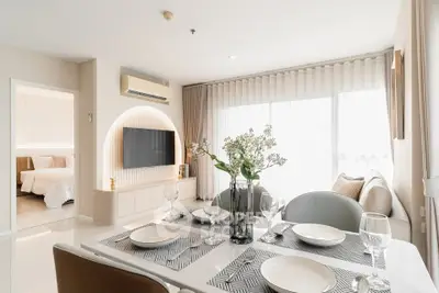 Elegant modern living room with dining area and stylish decor