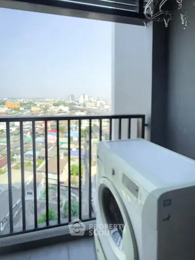 High-rise balcony with washing machine and panoramic city view, perfect for urban living.