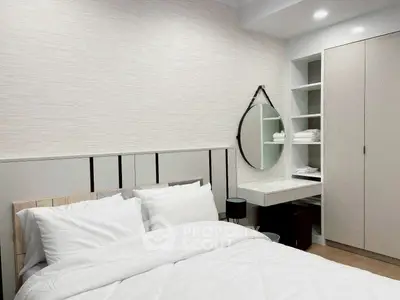 Modern bedroom with stylish decor and built-in storage solutions