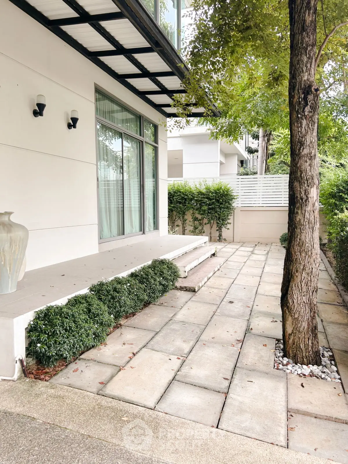 Charming garden patio with lush greenery and modern exterior design