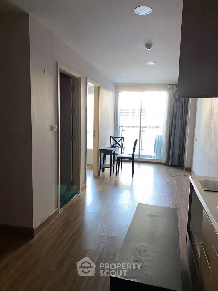 Modern apartment interior with wooden flooring and natural light