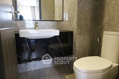 Modern bathroom with sleek marble design and contemporary fixtures