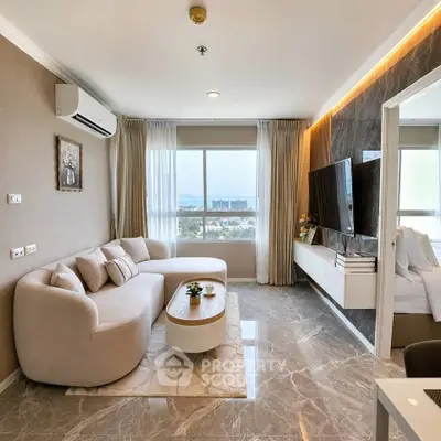 Luxurious living room with modern decor, large windows, and stunning city view.