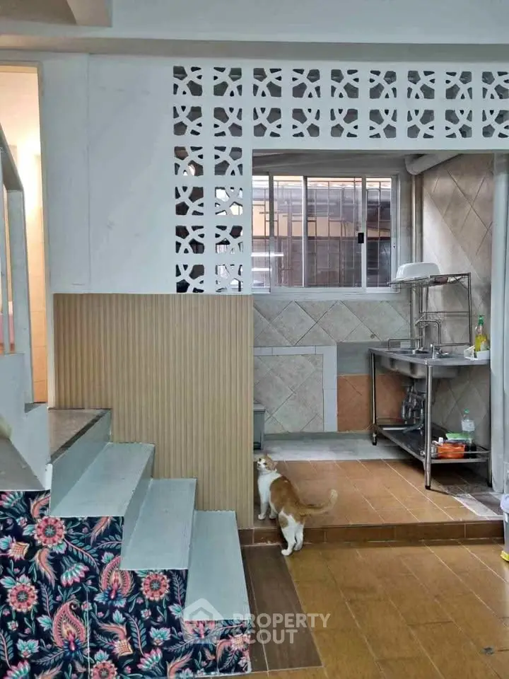 Charming interior with unique tile design and cozy kitchen area, perfect for modern living.