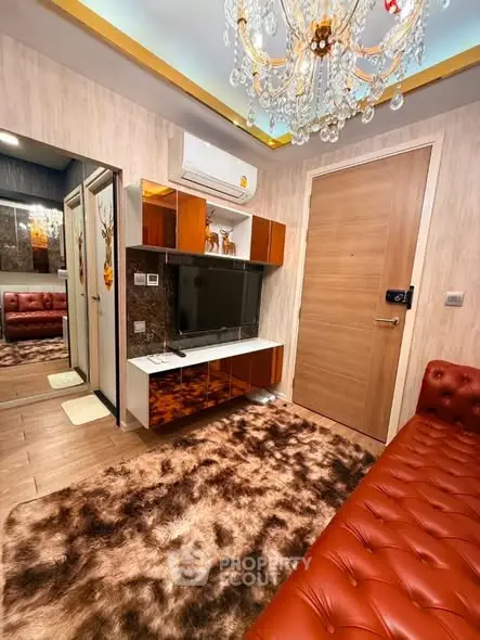 Luxurious living room with plush decor and elegant chandelier