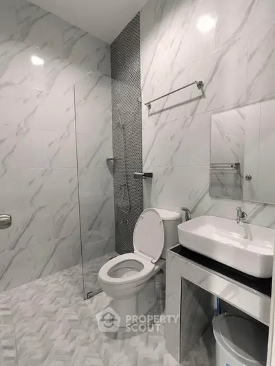 Modern bathroom with sleek design and glass shower partition