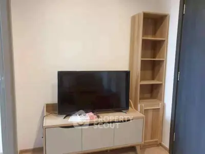 Modern living room with sleek TV stand and wooden shelving unit