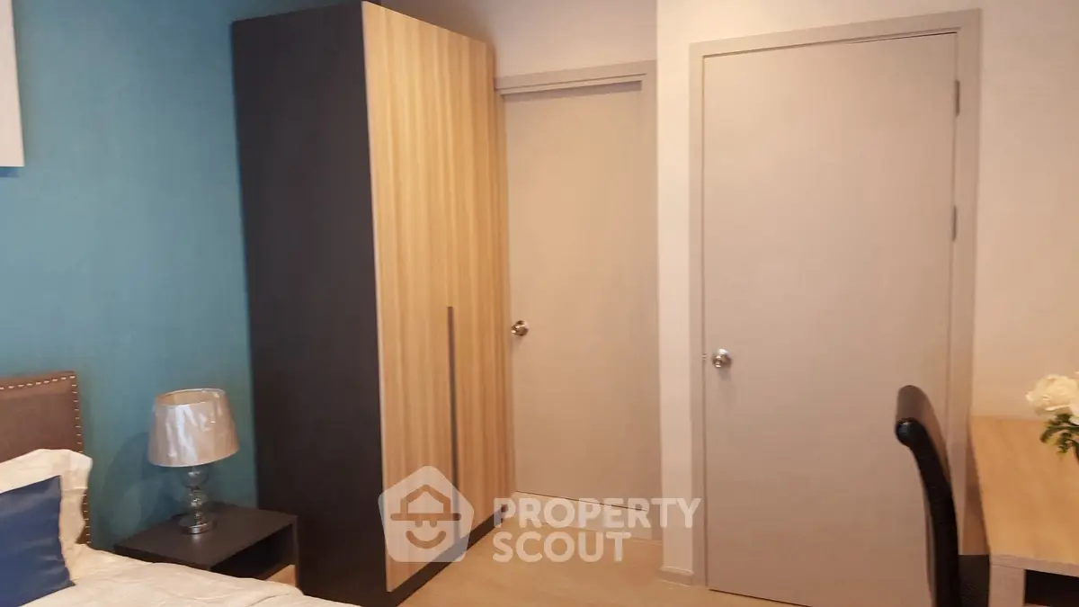 Cozy bedroom with modern wardrobe and stylish decor