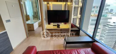 Modern living room with red leather sofa and large window view in high-rise apartment