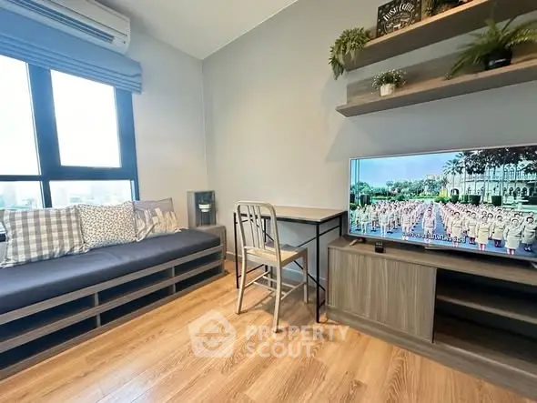 Modern living room with stylish decor, wooden flooring, and a cozy seating area.