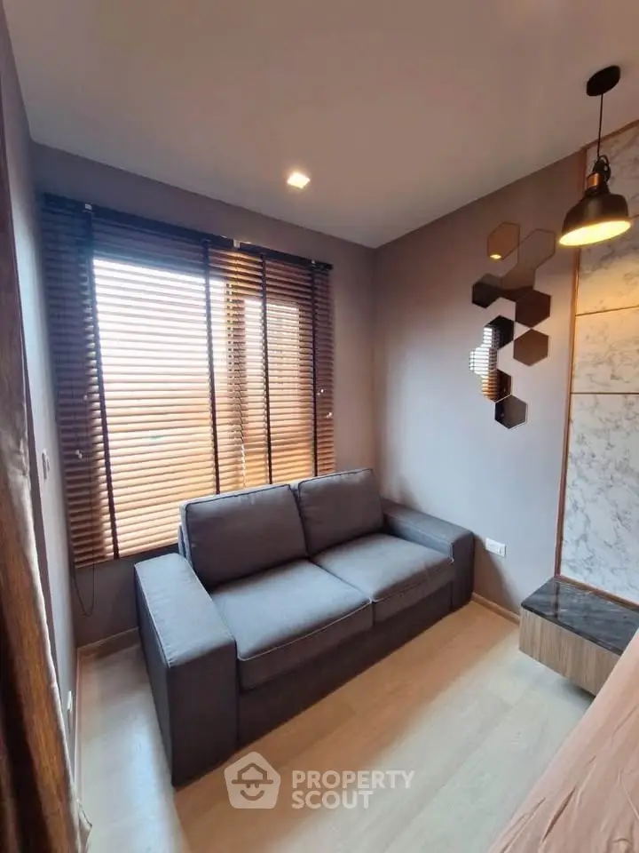 Modern living room with stylish decor and cozy gray sofa