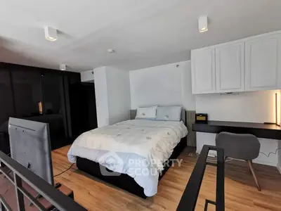 Modern bedroom with sleek design and integrated workspace