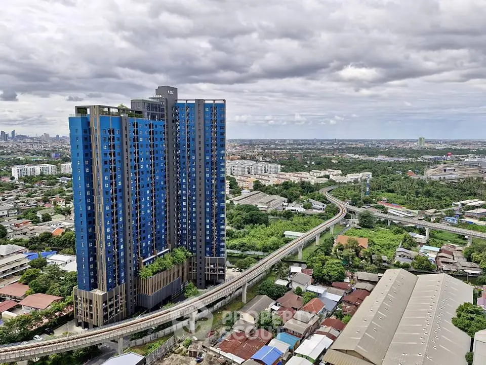 Stunning high-rise building with panoramic city views and lush greenery