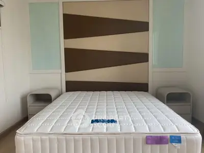 Modern bedroom with stylish headboard and comfortable mattress