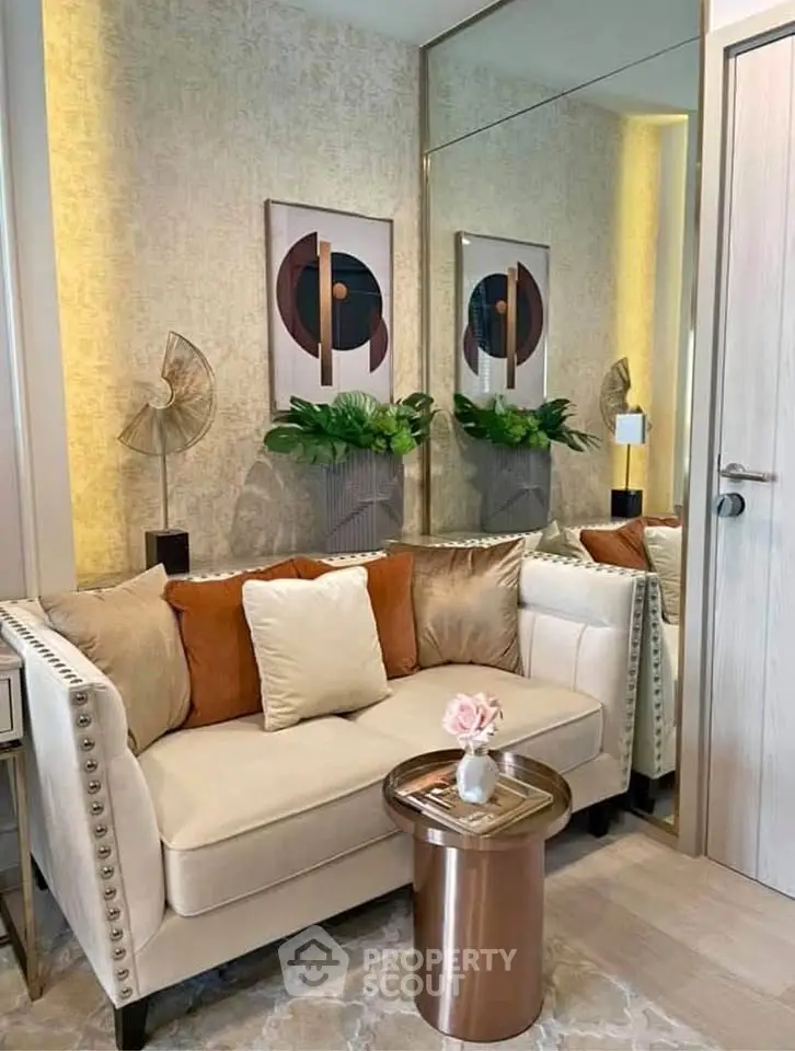 Stylish living room with elegant sofa, modern decor, and chic mirror enhancing space.