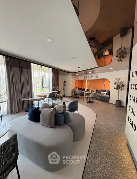 Modern living room with stylish furniture and large windows for natural light