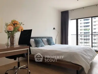 Modern bedroom with balcony view in urban apartment