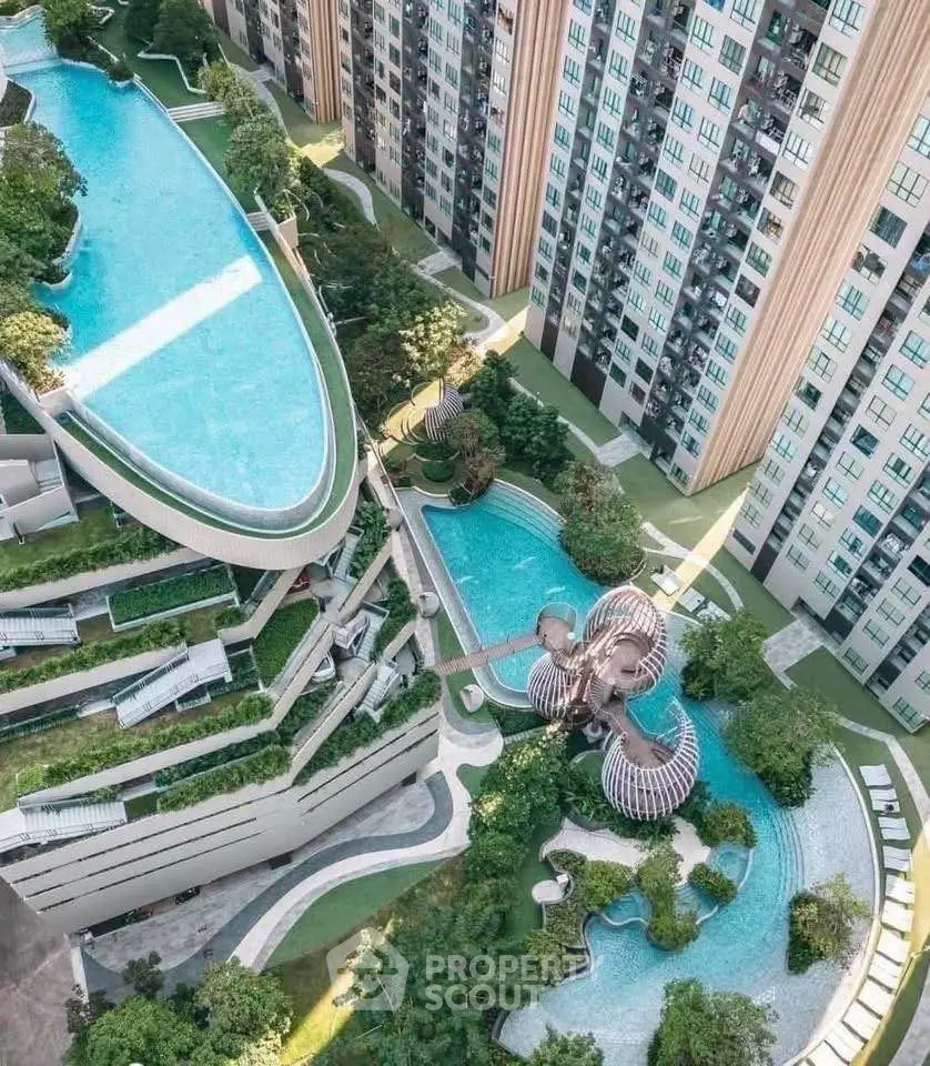 Luxurious high-rise apartment complex with stunning rooftop pool and lush landscaped gardens.