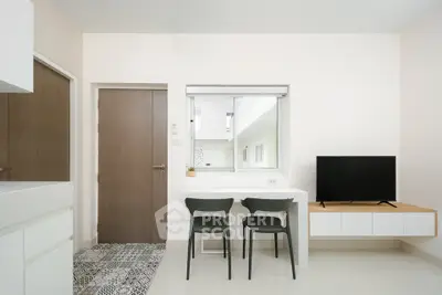 Modern minimalist living room with sleek furniture and neutral tones