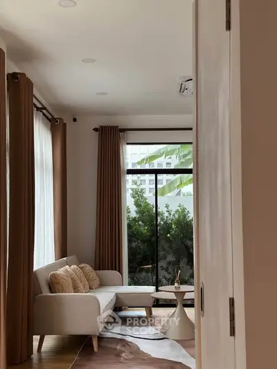 Stylish living room with modern sofa and large window view