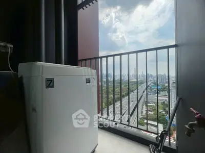 High-rise balcony with washing machine and stunning cityscape view