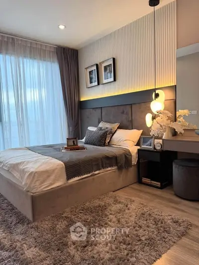 Luxurious modern bedroom with plush decor and ambient lighting, perfect for relaxation and comfort.