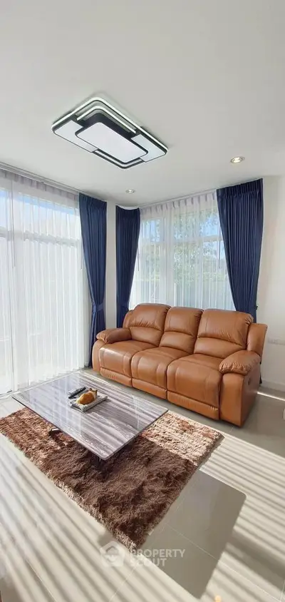 Stylish living room with leather sofa and modern decor