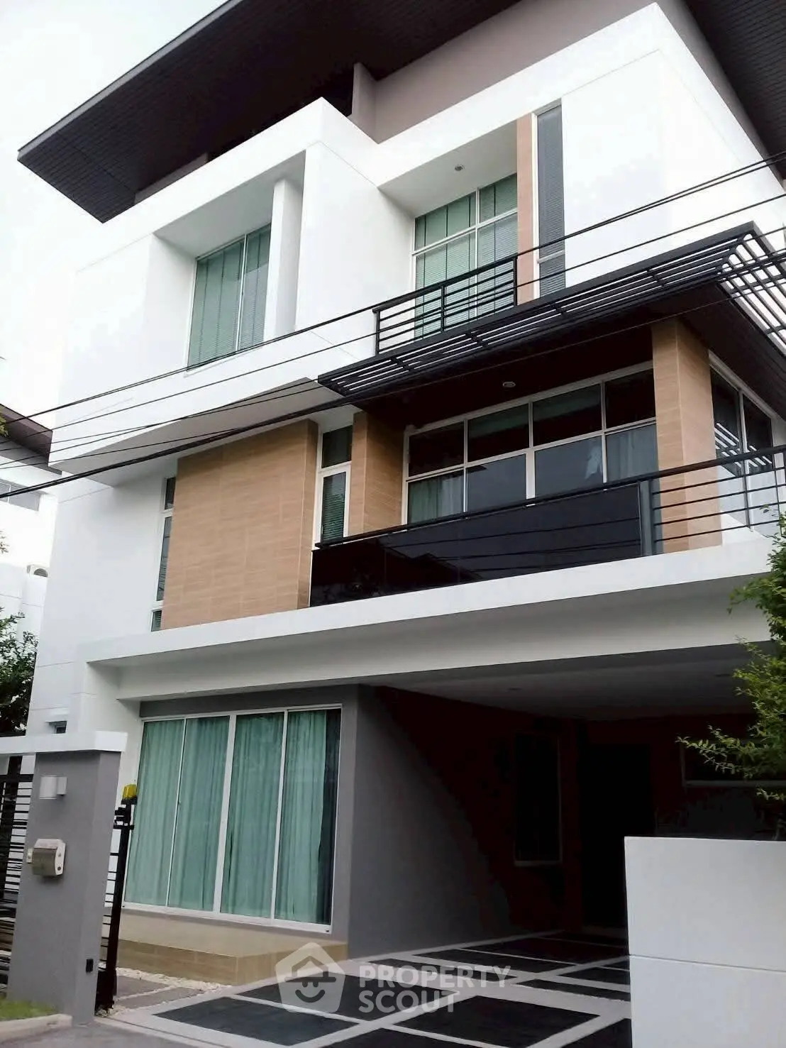 Modern multi-story building with sleek design and large windows