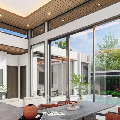 Luxurious modern living room with pool view and high ceilings