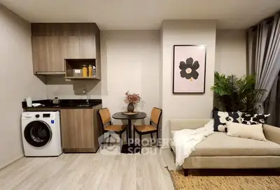 Modern studio apartment with compact kitchen and cozy living area