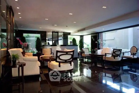 Luxurious modern living room with elegant furniture and large windows
