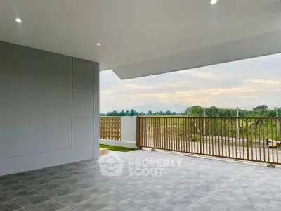 Spacious balcony with scenic view and modern design, perfect for relaxation and outdoor enjoyment.