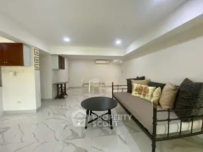 Spacious living room with modern decor and elegant flooring
