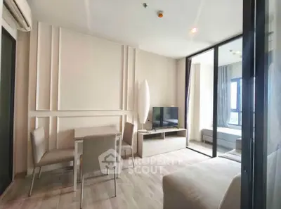 Modern living room with sleek furniture and natural light in a stylish apartment.