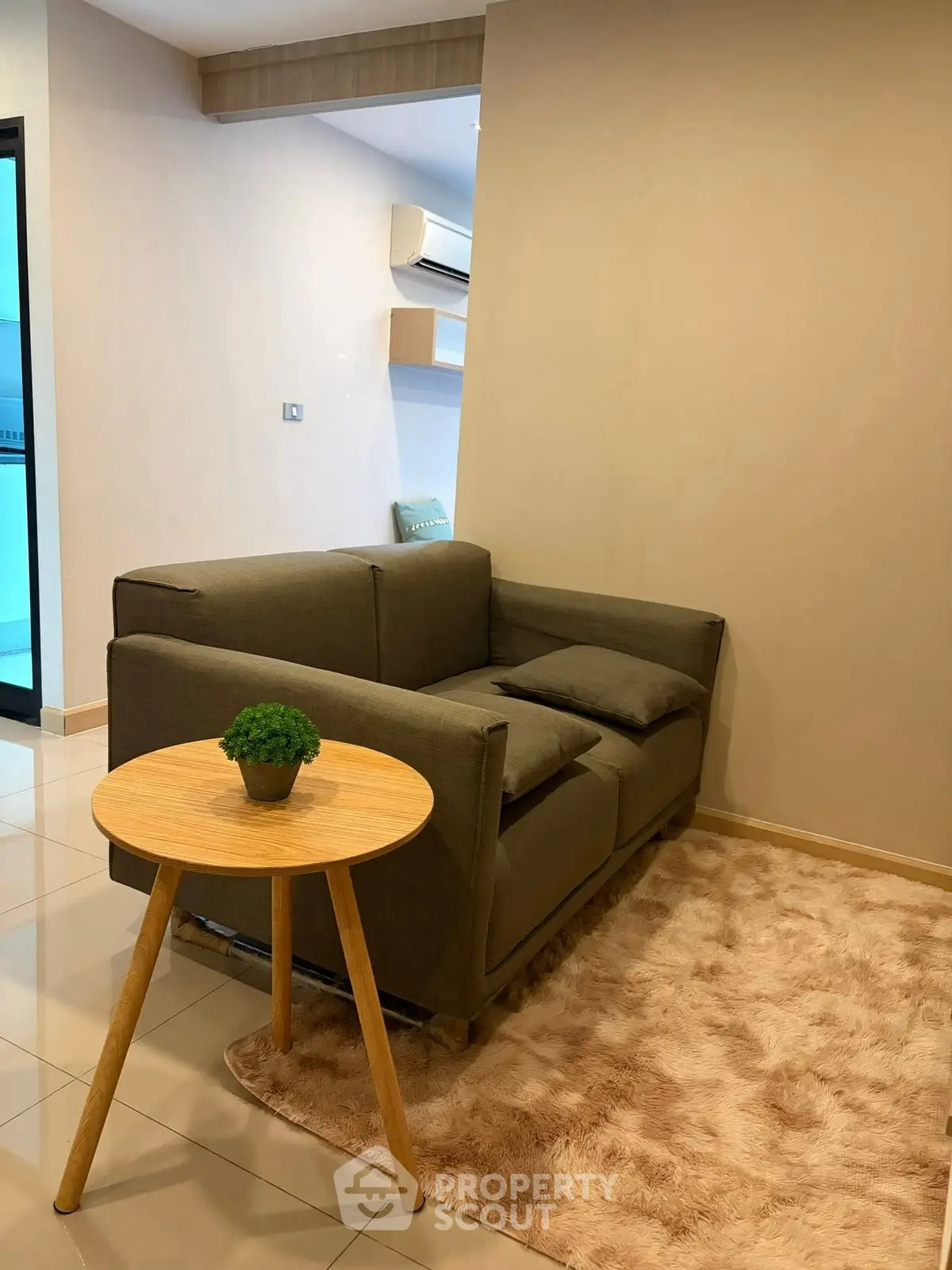 Cozy living room with modern sofa and stylish decor in a contemporary apartment.