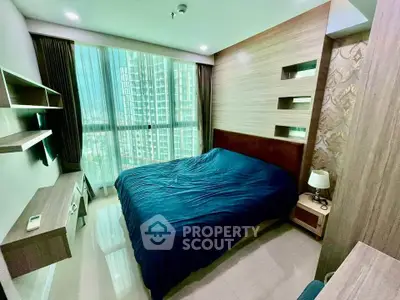 Modern bedroom with large window and stylish decor in high-rise apartment