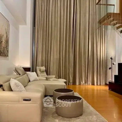 Luxurious living room with high ceilings and elegant decor