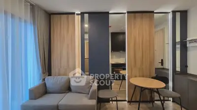 Modern living room with stylish furniture and wooden accents in a cozy apartment.