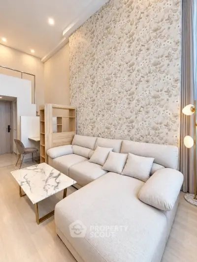 Modern living room with elegant wallpaper and stylish furniture in a cozy apartment.